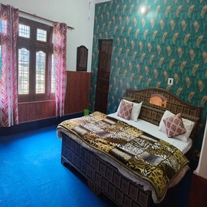 Image of beautiful room at Janki chatti provided in our package for char dham trip