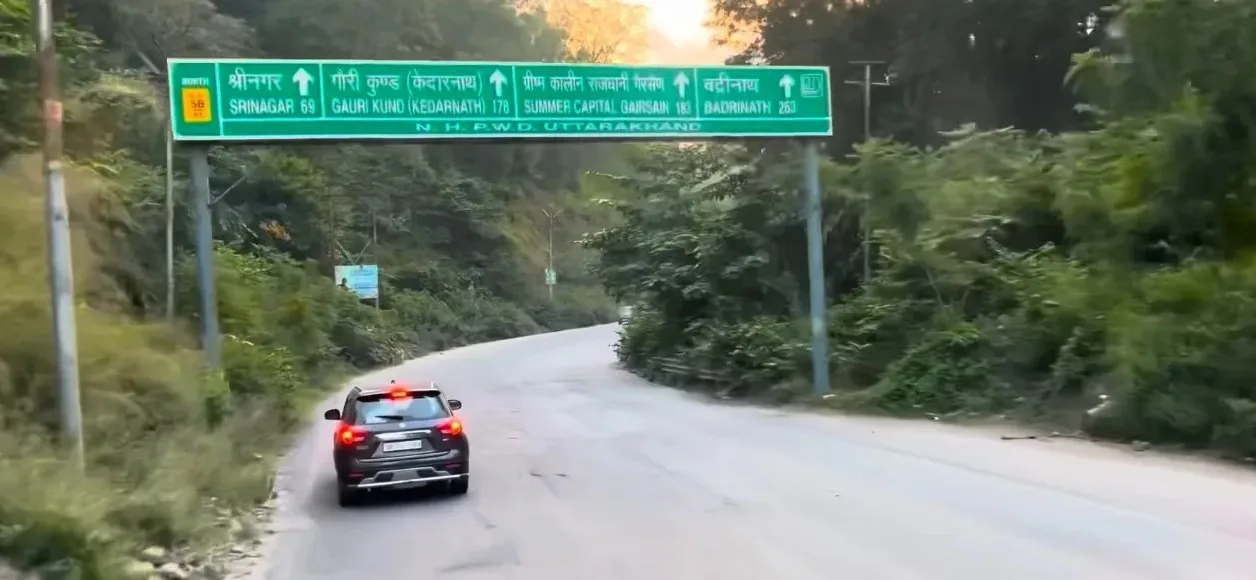 roadsighn board of badrinath temple distance on moving ahead of Rishikesh