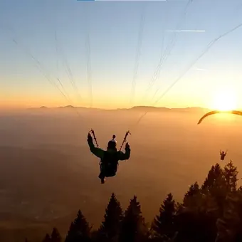 Paraglider at sunset over the Bir valley