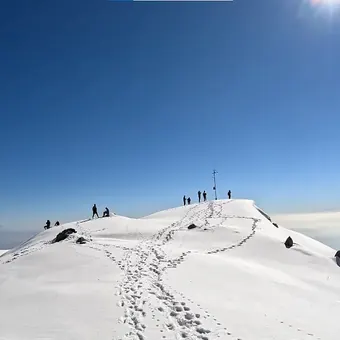 Footprints on the snowy Triund ridge