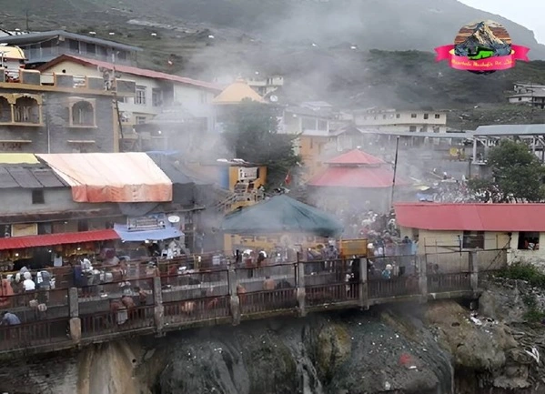Beautiful image of hot water vapour from tapt kund with snow covered mountains in the background