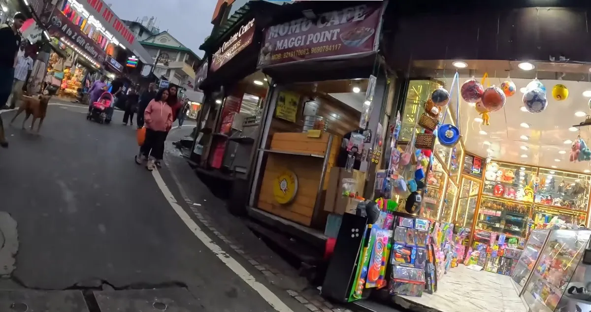 Shops and cafes along Mall Road in Nainital