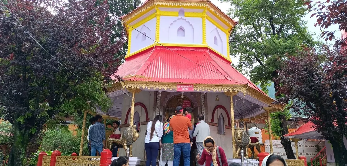 Devotees at the Naina Devi Temple shrine on the shore of Naini Lake, Nainital
