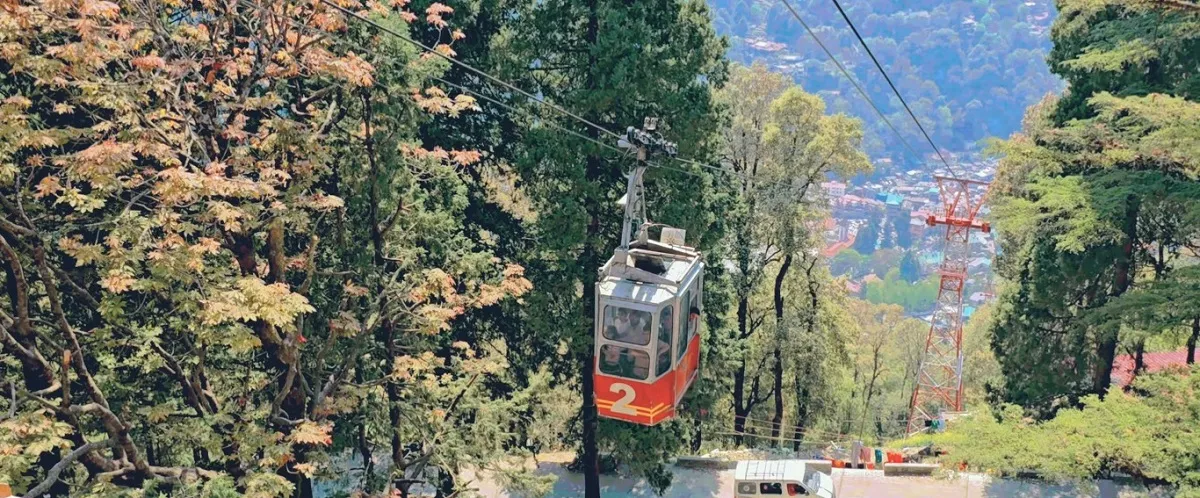 Nainital ropeway cable car climbing through the trees towards Snow View Point