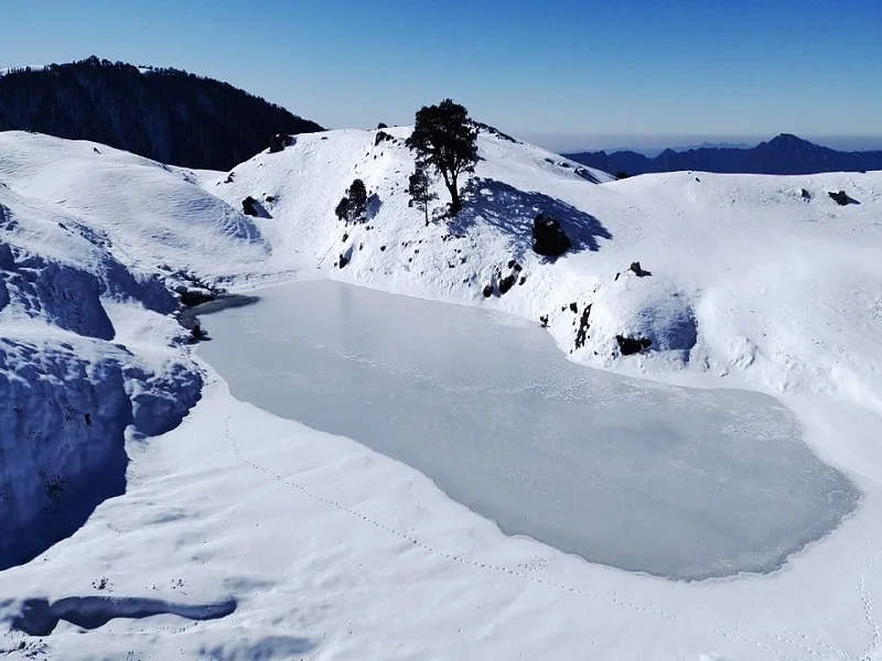 image of frozen lake of Brahmatal, best winter trek in Uttarakhand