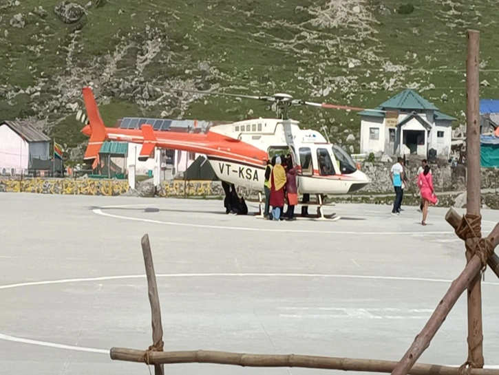 Pilgrims boarding helicopter for Kedarnath and Badrinath Do Dham Yatra