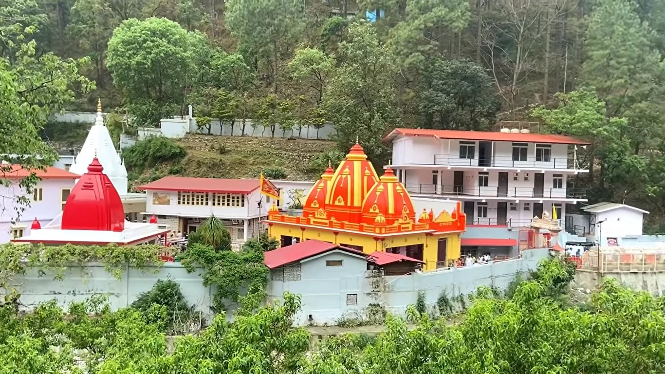 Kainchi Dham temples and ashram buildings among pine-covered hills