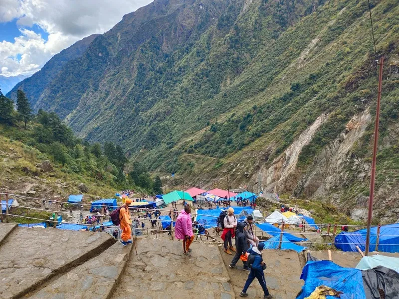 Trekkers trekking up on the route to kedarnath temple coming from pune