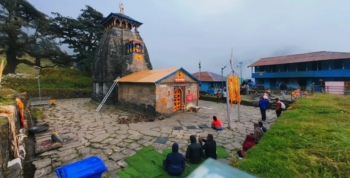 Devotees in the stone courtyard of Madhyamaheshwar Temple, the second Panch Kedar shrine
