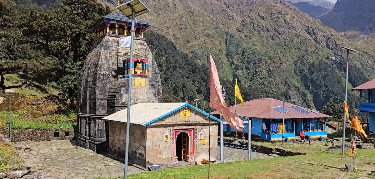 Madhyamaheshwar Temple, the second Kedar, with its stone shikhara and prayer flags