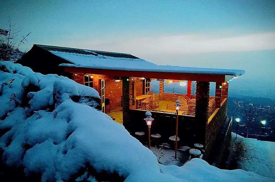 Snowcovered cafe on trekking route of Laka Glacier trek