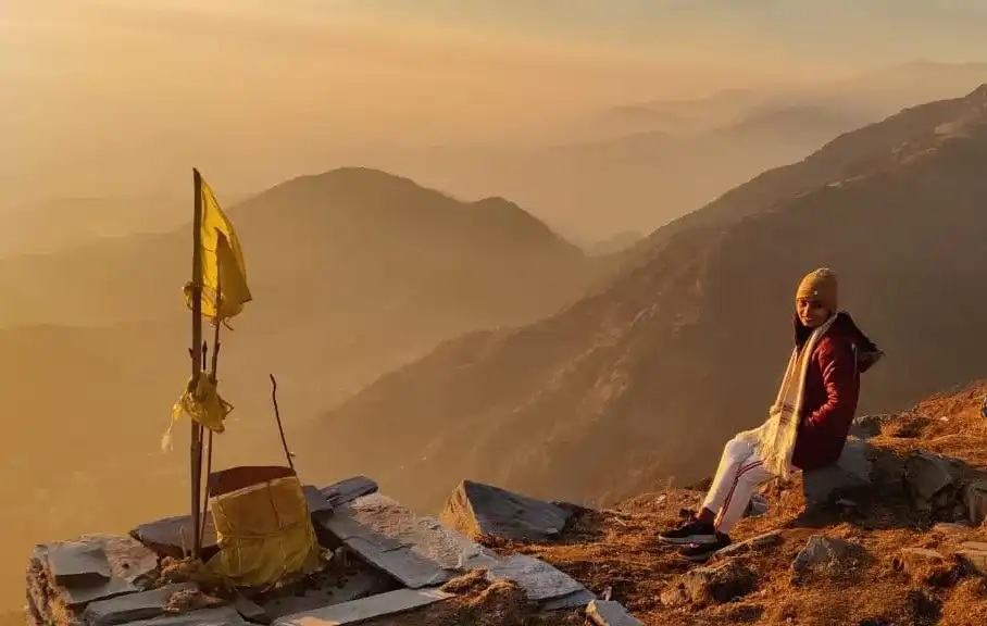 A solo lady trekker of Manchala Mushafir Posing near shiv temple enroute to Laka glacier summit